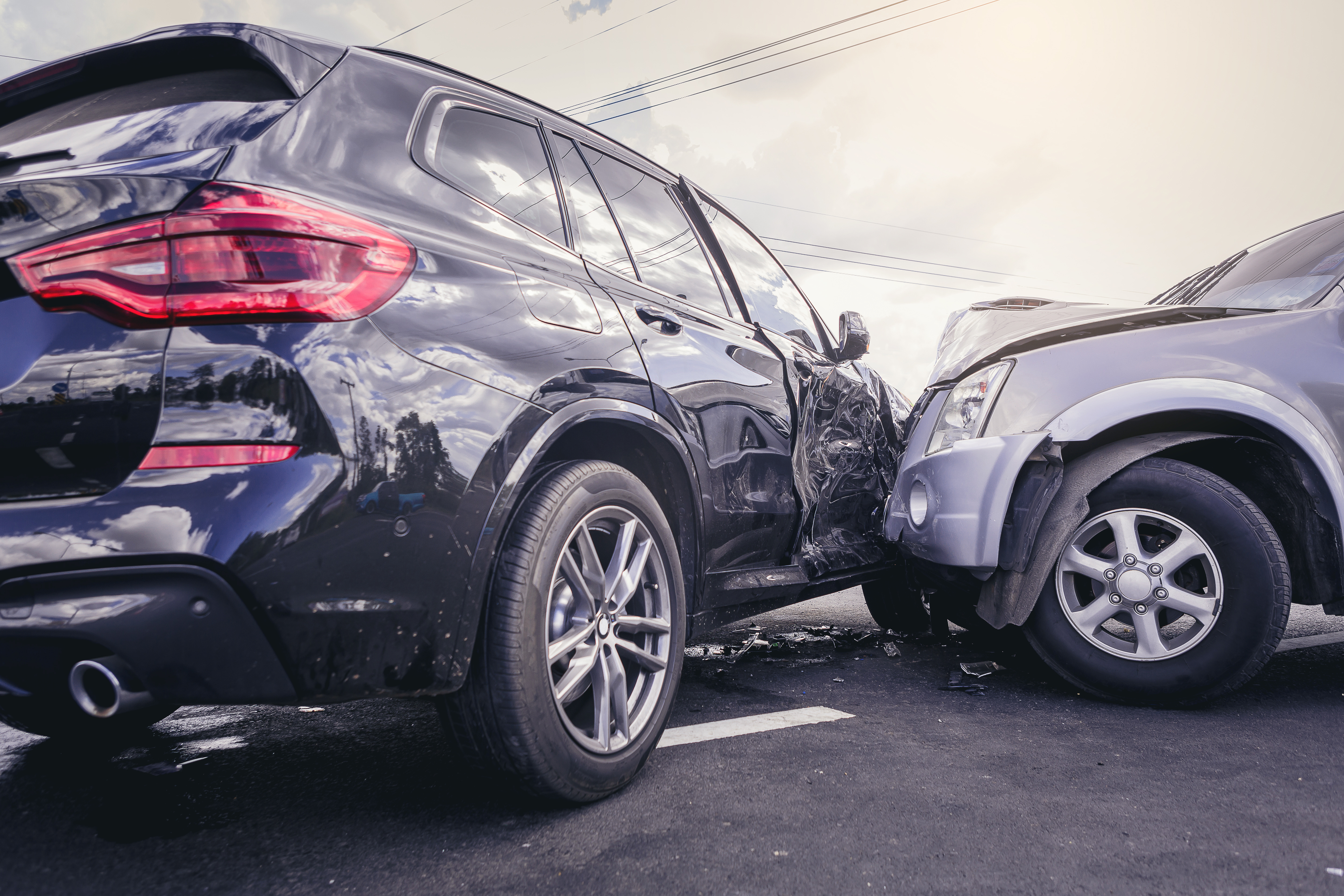Two cars wrecked into each other with damage. | Personal Injury | The Sullivan Law Firm