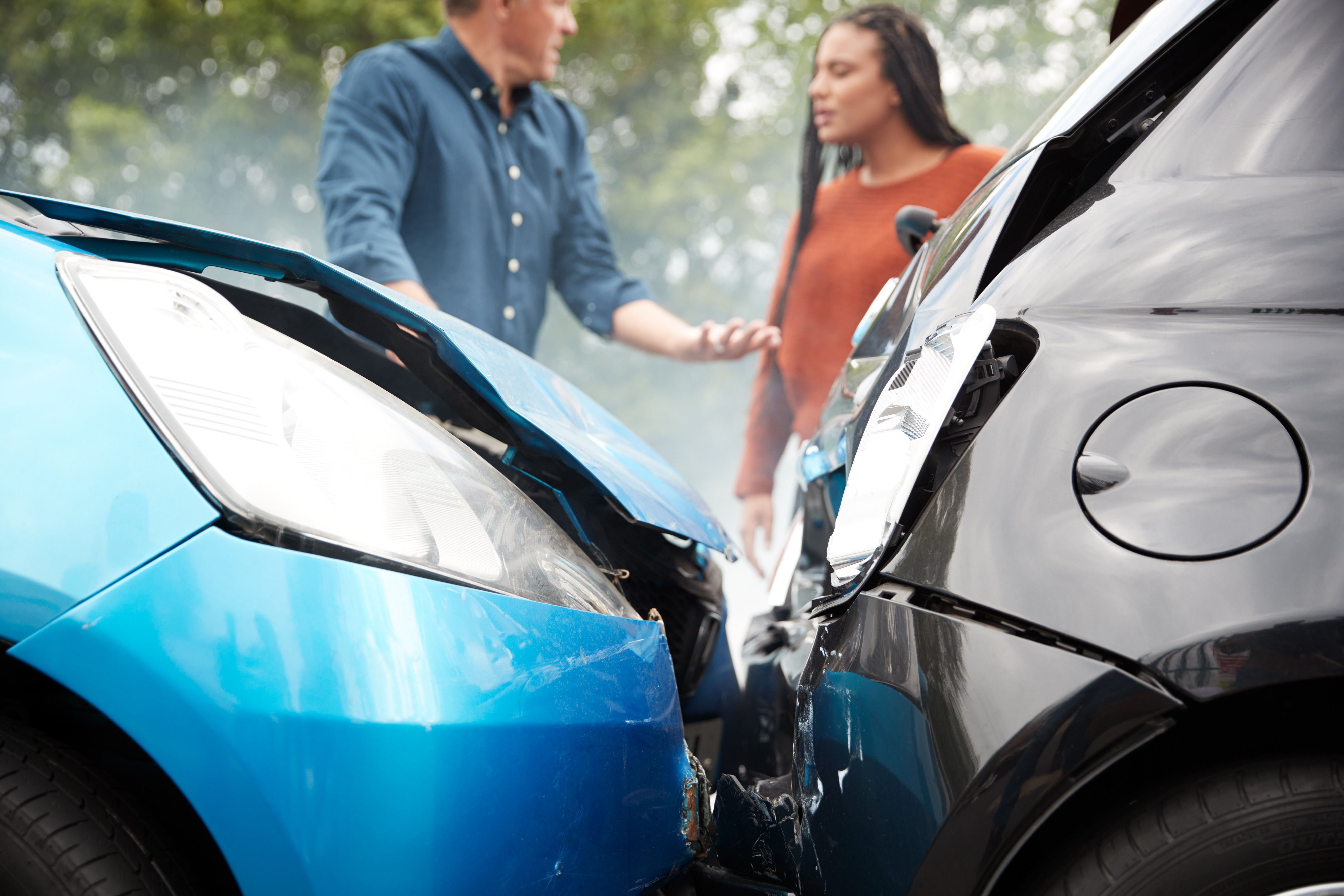 Two Angry Motorists Arguing Over Responsibility For Car Accident - Sullivan Law Firm