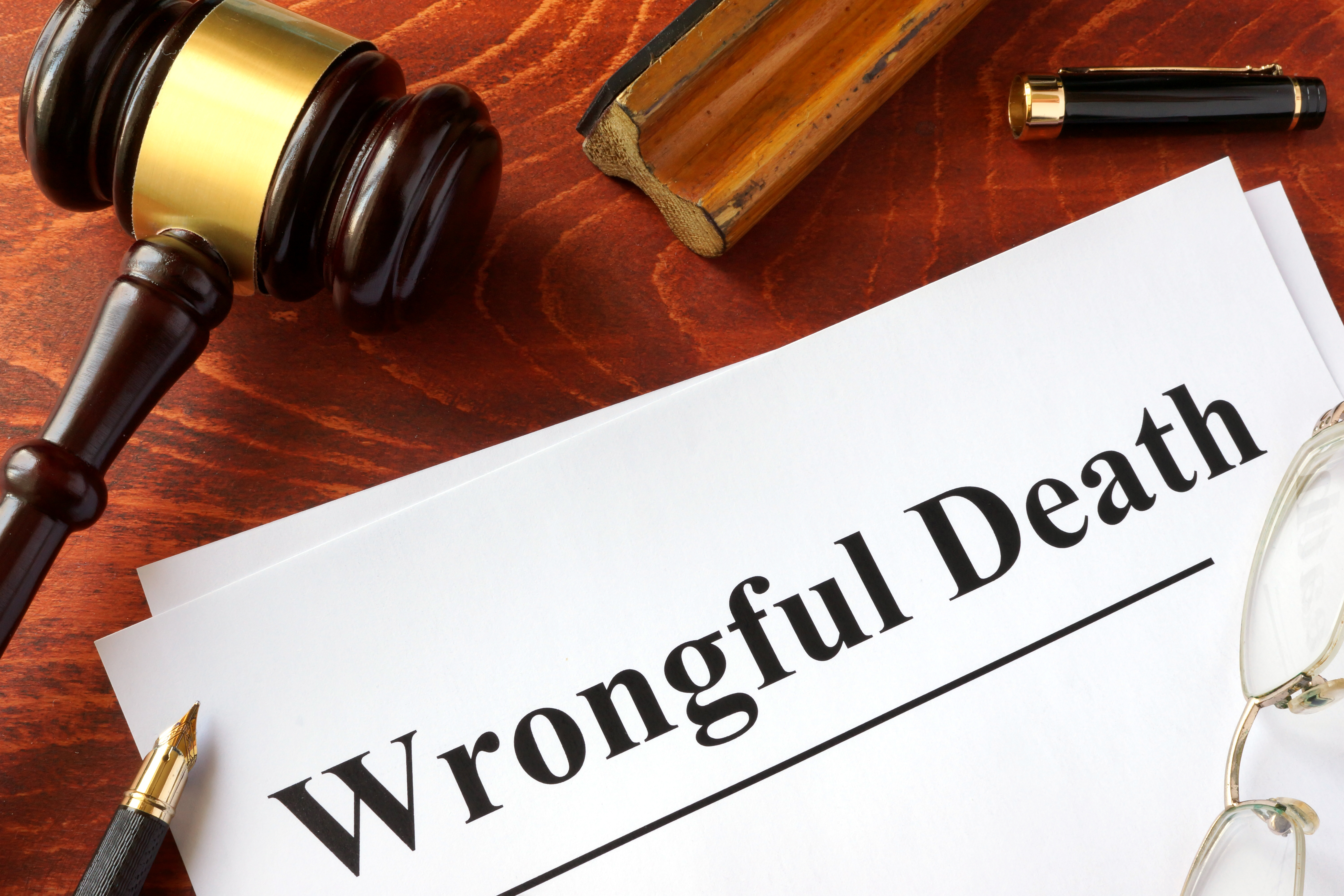 Wrongful death legal document with gavel representing wrongful death claims handled by Sullivan Law Firm.